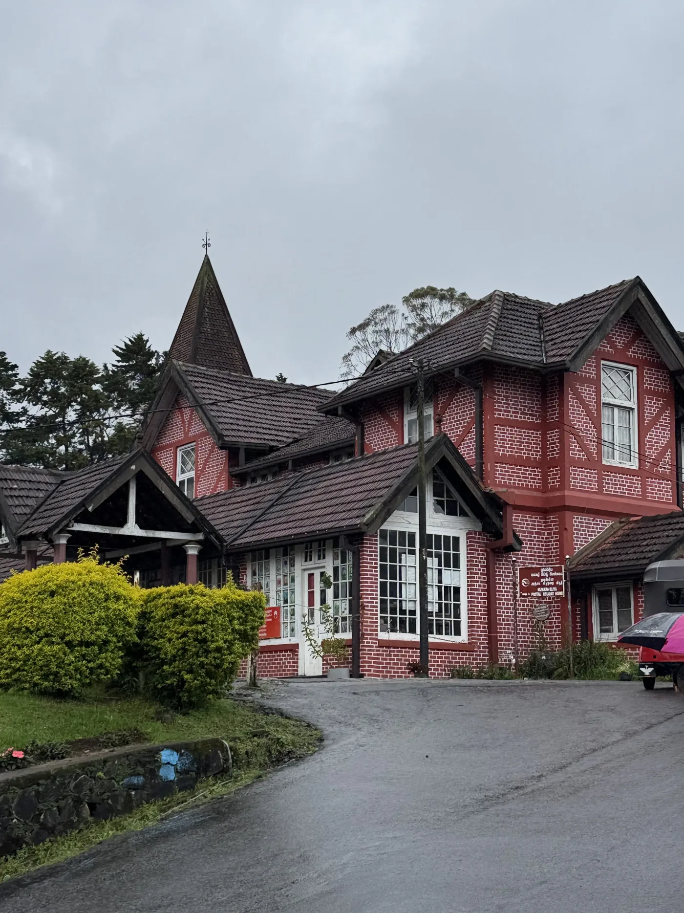 A red colonial-era post office building in Sri Lanka's hill country